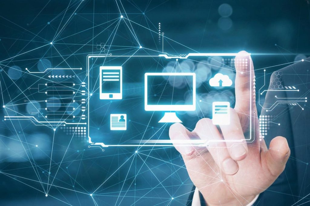 Businessman touching a digital display showing cloud servers, devices and data flow